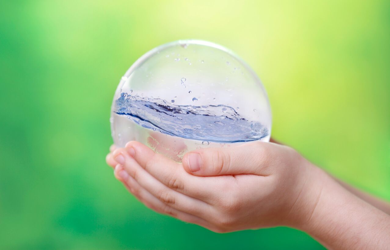 Hands Holding Ball of Water