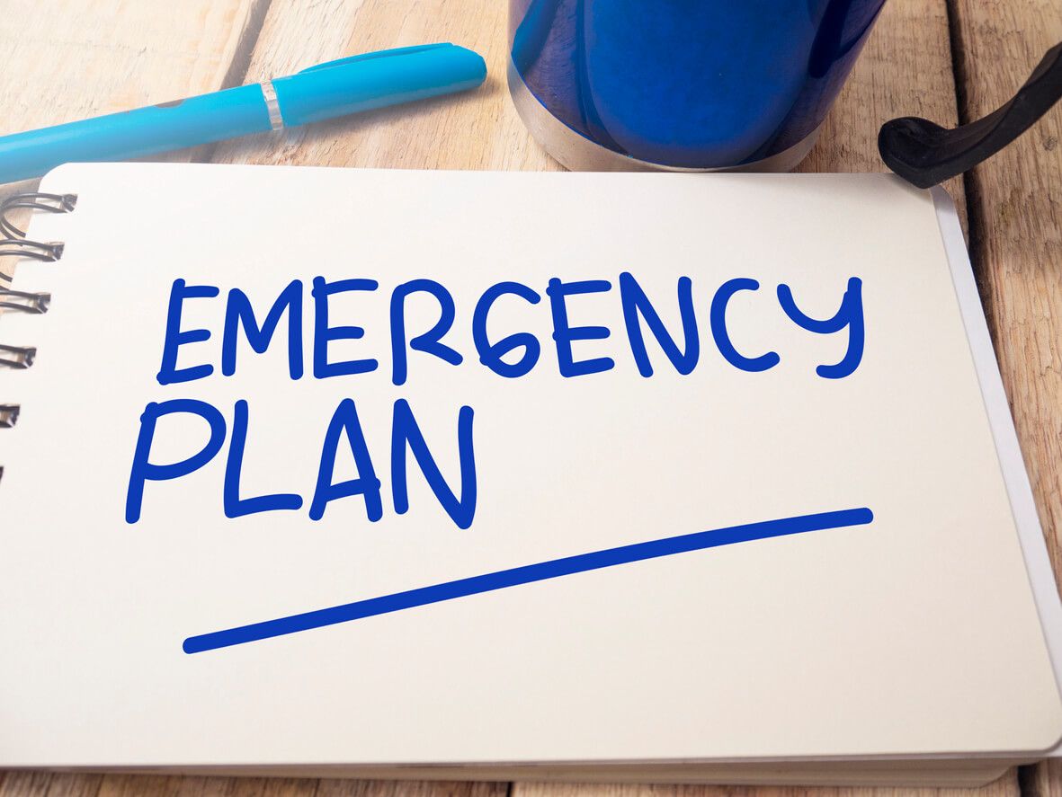 Paper with "Emergency Plan" written on it